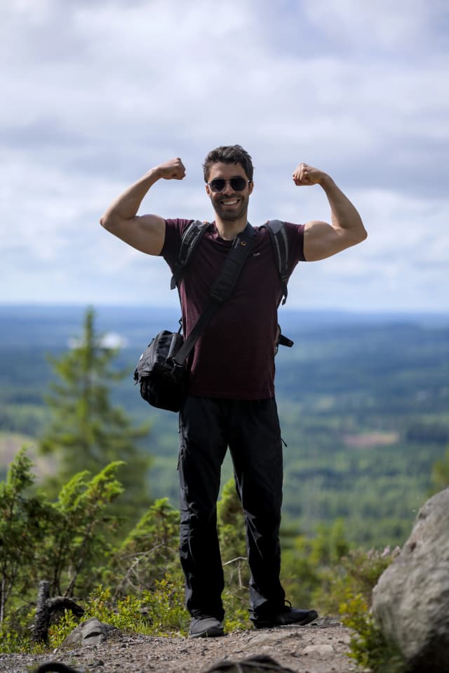 Dr. Night flexing in a forest
